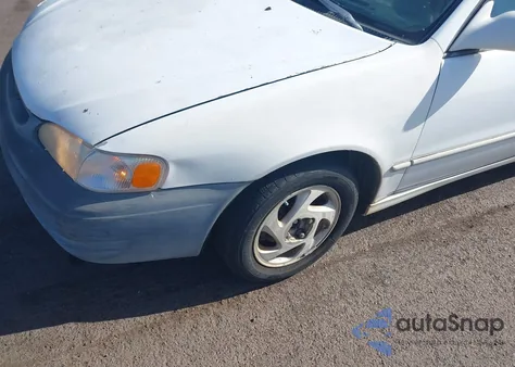 2000 Toyota Corolla Le z USA, uszkodzony, nr VIN 1NXBR12E6YZ319786